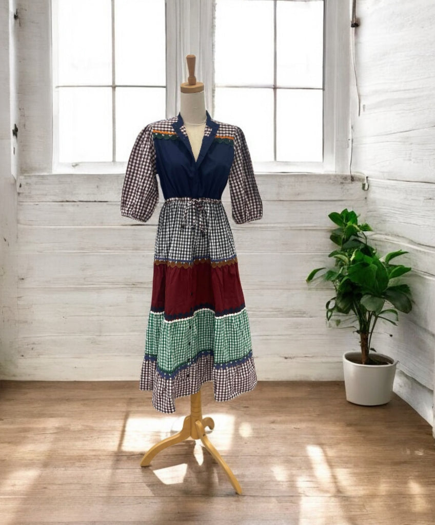 this 100% cotton tiered dress features a flattering drawstring waist and soft tiers that move with you.