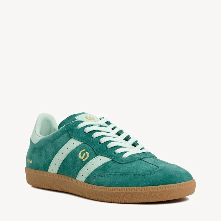 Green sneaker with white accents on a white background