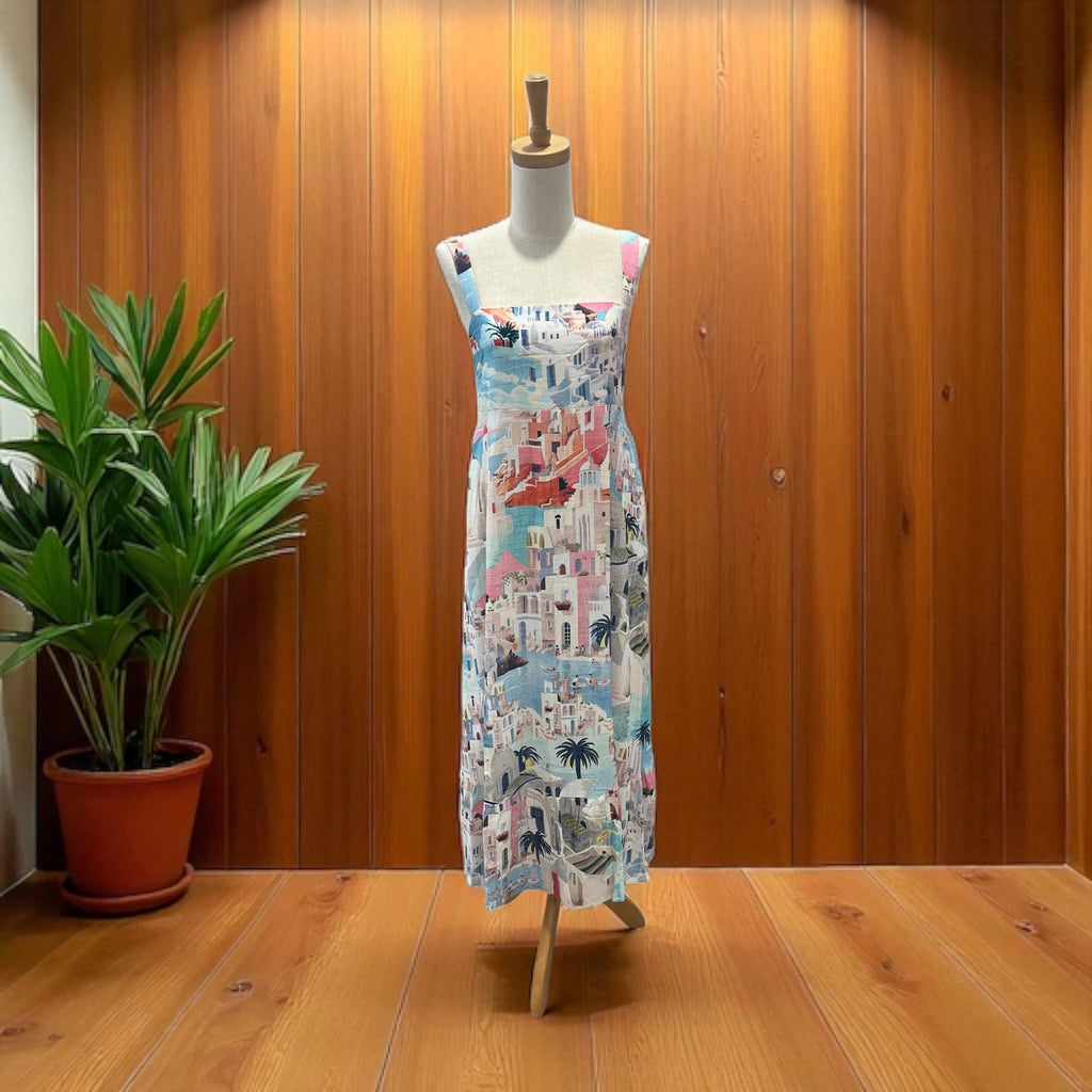 Mannequin wearing a colorful dress with a wooden background