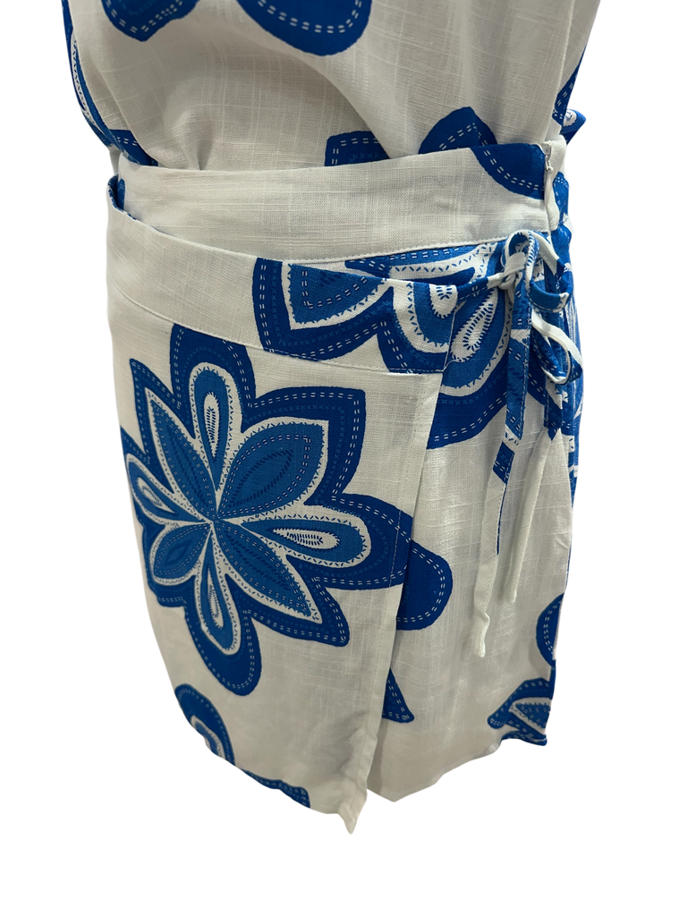 White skort with blue floral patterns on a white background