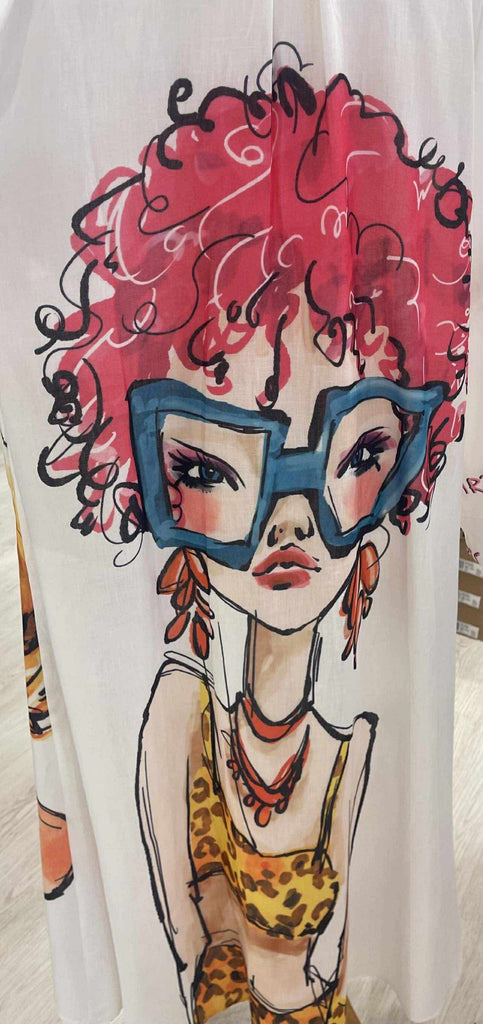 White shirt with a colorful graphic of a woman with red hair and large blue sunglasses.